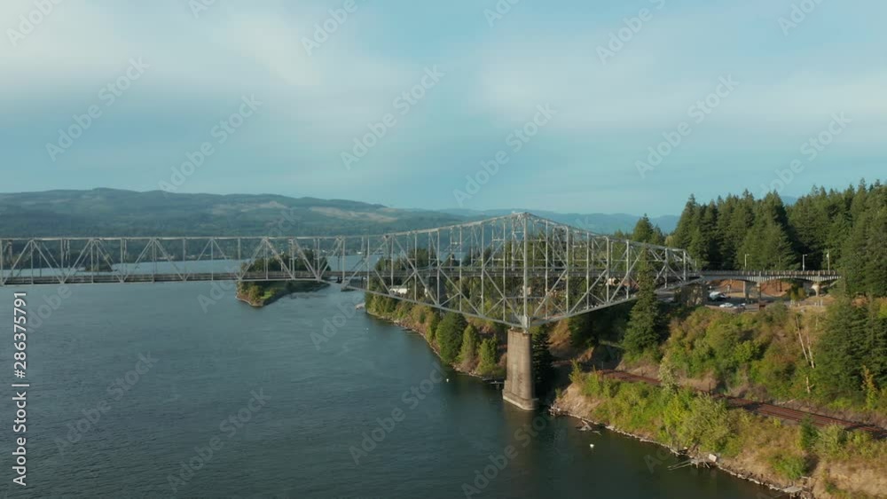 The Bridge of the Gods is a steel truss cantilever bridge that spans the Columbia River between Cascade Locks, Oregon, and Washington state near North Bonneville. 