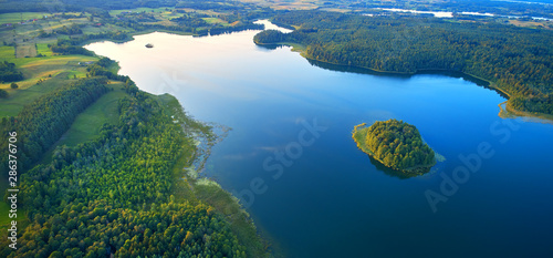 Obraz na płótnie Aerial landscape from the drone - lake in masuria lake district