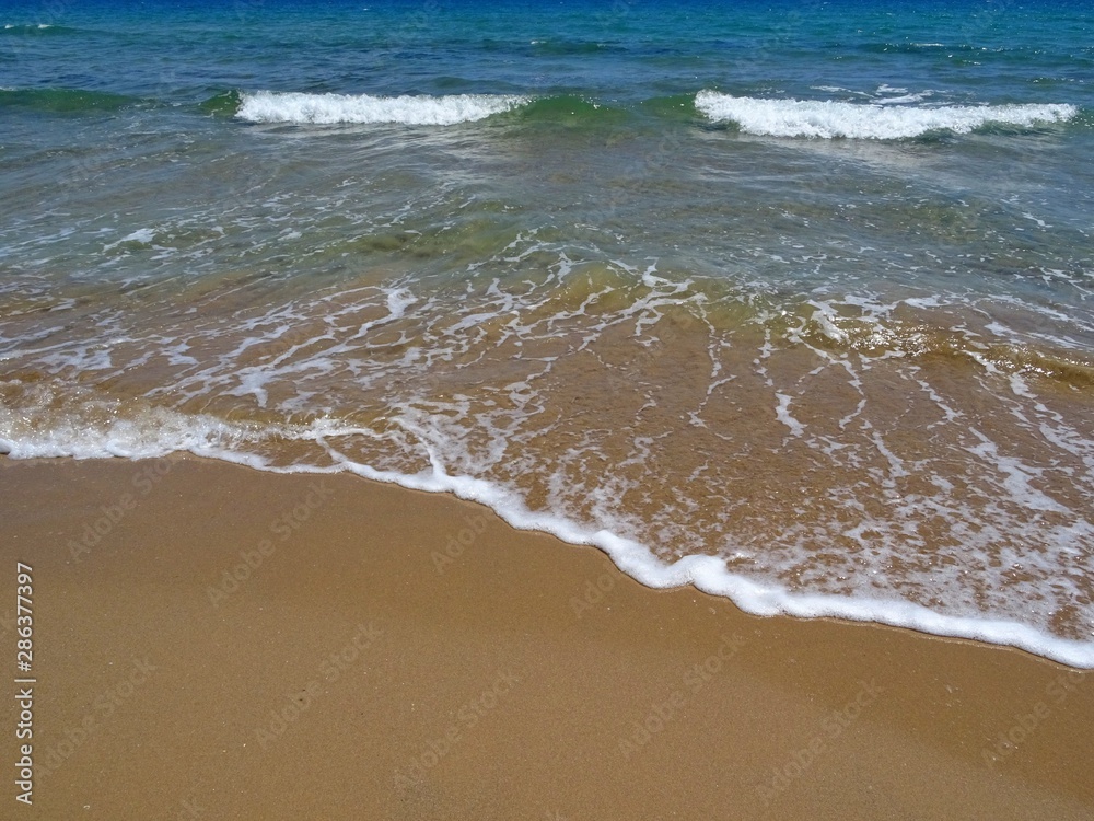 sea ​​wave on the seashore of a white sandy beach in summer no people