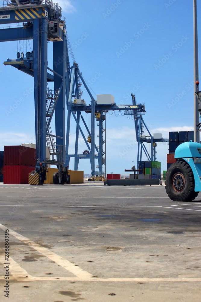 Gantry Crane Rail Mounted handling shipping containers in the harbour area