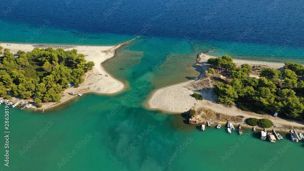 Aerial drone view of iconic sandy bay and turquoise beach of Galrokavos in Kassandra Peninsula, Halkidiki, North Greece