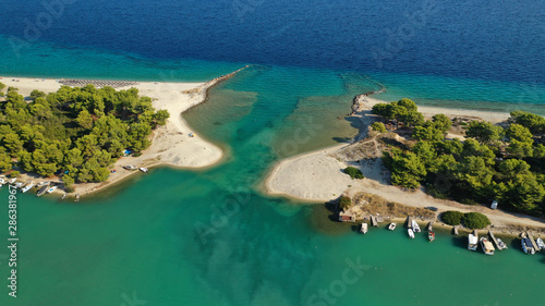 Aerial drone view of iconic sandy bay and turquoise beach of Galrokavos in Kassandra Peninsula, Halkidiki, North Greece © aerial-drone