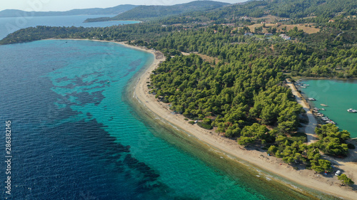 Fototapeta Naklejka Na Ścianę i Meble -  Aerial drone view of iconic sandy bay and turquoise beach of Galrokavos in Kassandra Peninsula, Halkidiki, North Greece