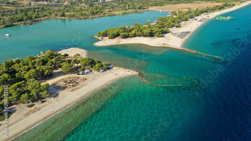 Aerial drone view of iconic sandy bay and turquoise beach of Galrokavos in Kassandra Peninsula, Halkidiki, North Greece © aerial-drone