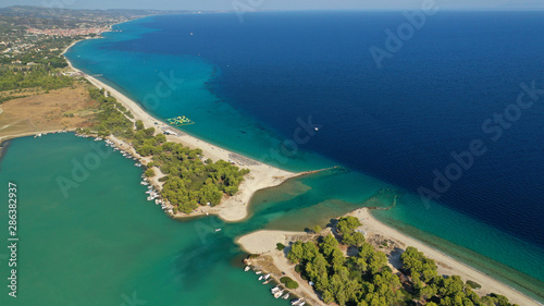 Aerial drone view of iconic sandy bay and turquoise beach of Galrokavos in Kassandra Peninsula  Halkidiki  North Greece