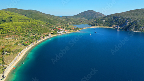 Aerial drone photo of iconic paradise bay and sandy beach of Porto Koufo with turquoise calm sea protected by winds, South Sithonia Peninsula, North Greece