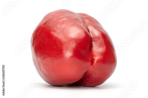 One whole red bell pepper back side isolated on white background