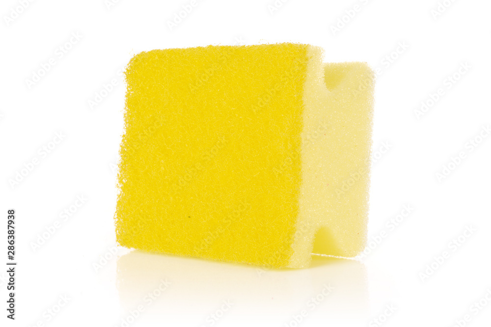 One whole yellow cleaning kitchen sponge letter shape isolated on white background One whole yellow cleaning kitchen sponge letter shape isolated on white background