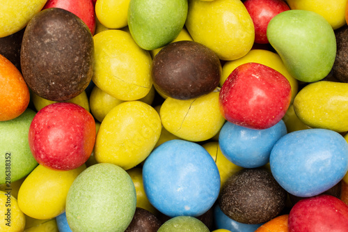 Closeup of lot of whole sugared nut dragee flatlay isolated on white background