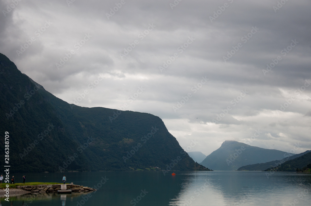 : Amazing nature view with fjord and mountains. Beautiful reflection. Location: Scandinavian Mountains, Norway