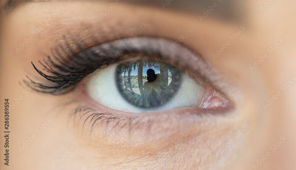 Beautiful blue woman single eye close up Beautiful blue woman single eye close up