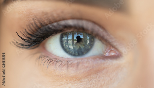 Beautiful blue woman single eye close up