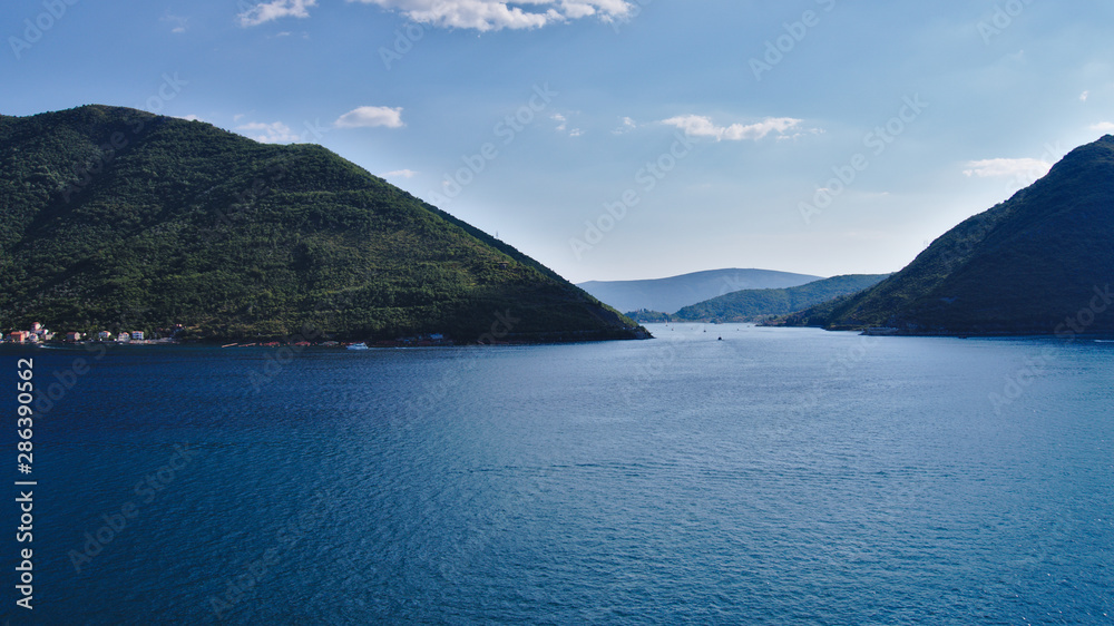 Beautiful view from the window of the tower in Perast to the bay and mountains