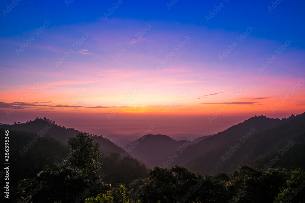 sun rise over a fog and mountain  in Thailand