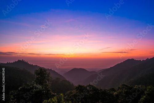 sun rise over a fog and mountain in Thailand