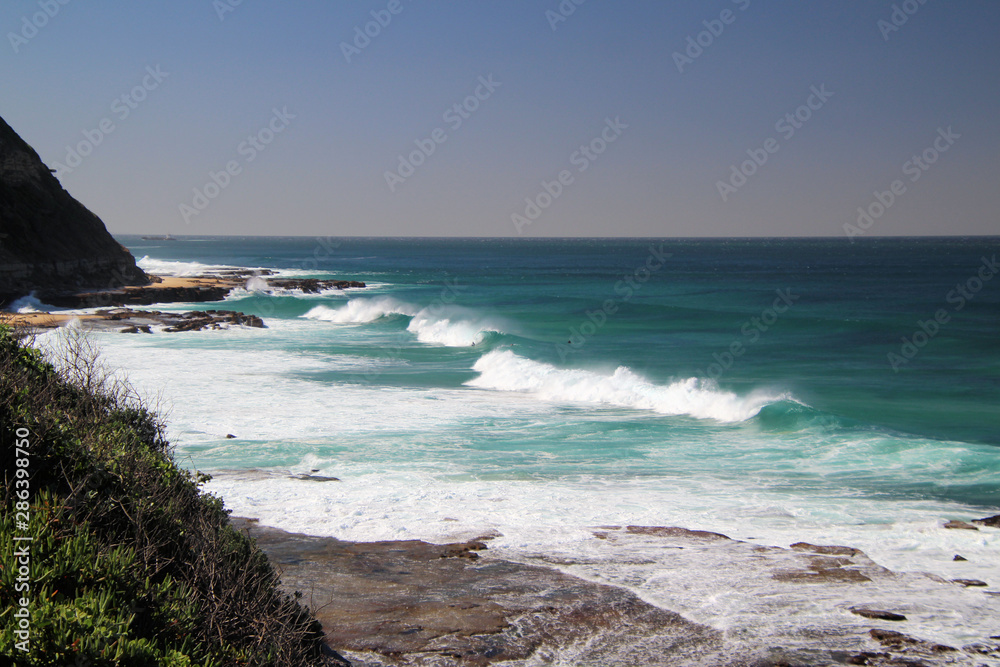 Heavy Swell and Surf Crashing on Rocks