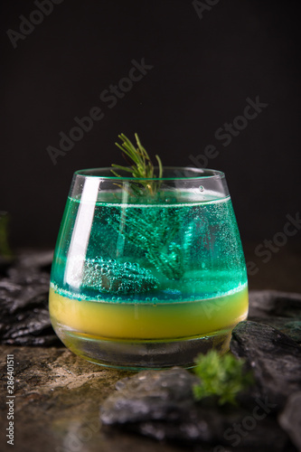 Sweet Famous Bluemarine juicy blue sea concept coctail from vodka, lime juice, inger ale, blue curacao. Cool alcoholic or non-alcoholic drink . Cocktail card