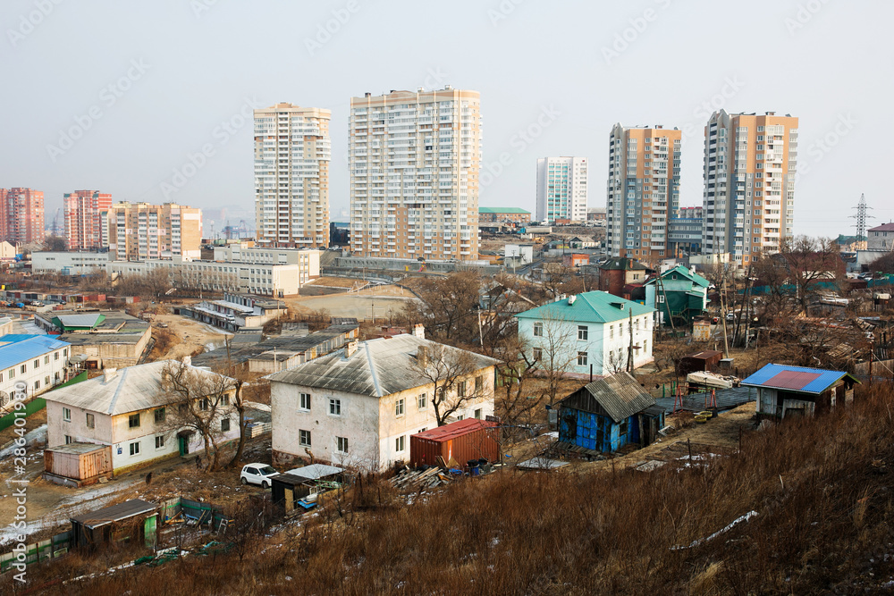 January, 2014 - Vladivostok, Russia - Industrial zone of a large city. Residential areas on the outskirts of the city