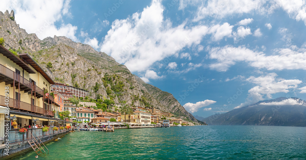 LIMONE SUL GARDA, ITALY - JUNE 13, 2019: The little town under the alps rocks.