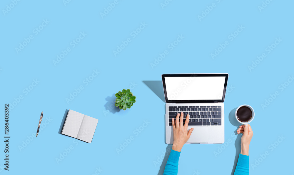 Person using a laptop computer from above