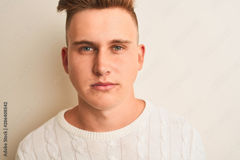 Young handsome man wearing casual t-shirt standing over isolated white background with a confident expression on smart face thinking serious Young handsome man wearing casual t-shirt standing over isolated white background with a confident expression on smart face thinking serious