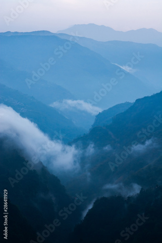 Mountains with valley and mist or fog in the morning  color shades of mountains in Nepal