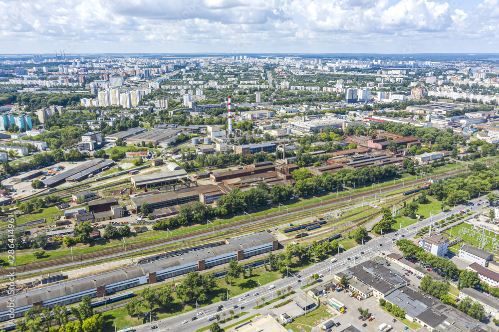aerial panoramic image of city industrial zone. top view of roofs of warehouses