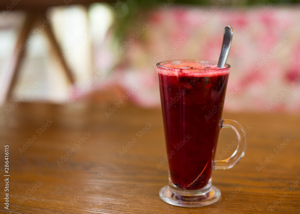 Hot vitamin fruit tea on wood table. Hot vitamin fruit tea on wood table.