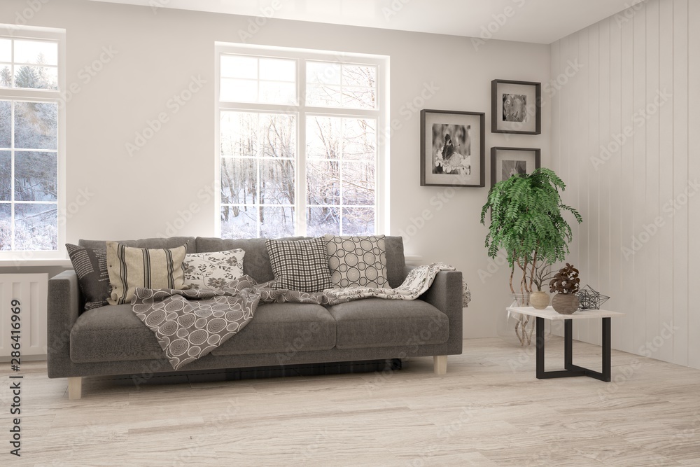 Stylish room in white color with sofa and winter landscape in window. Scandinavian interior design. 3D illustration Stylish room in white color with sofa and winter landscape in window. Scandinavian interior design. 3D illustration