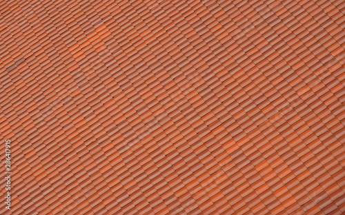 close up on red shingle on the roof