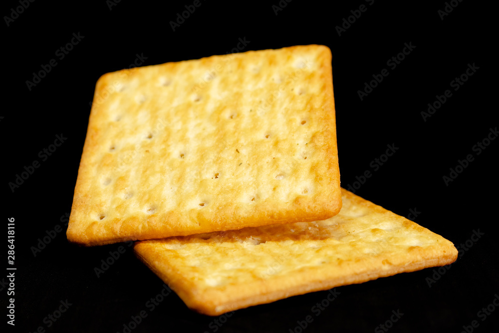 Fototapeta premium Cracker cookies on dark background.