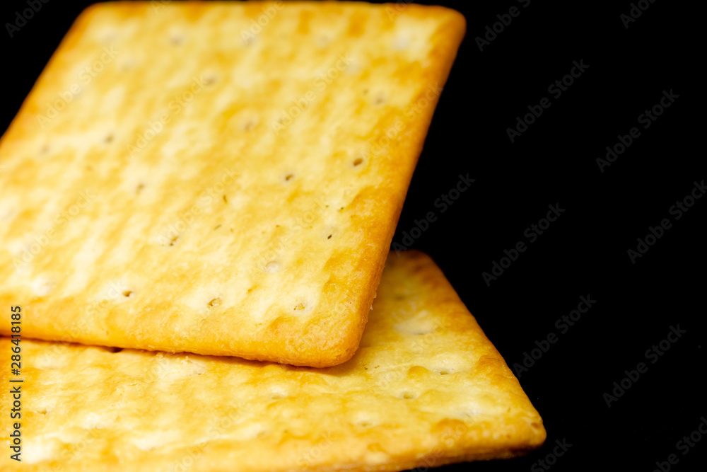 Fototapeta premium Cracker cookies on dark background.