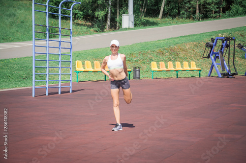 Female athlete preparing legs for cardio workout © bisonov