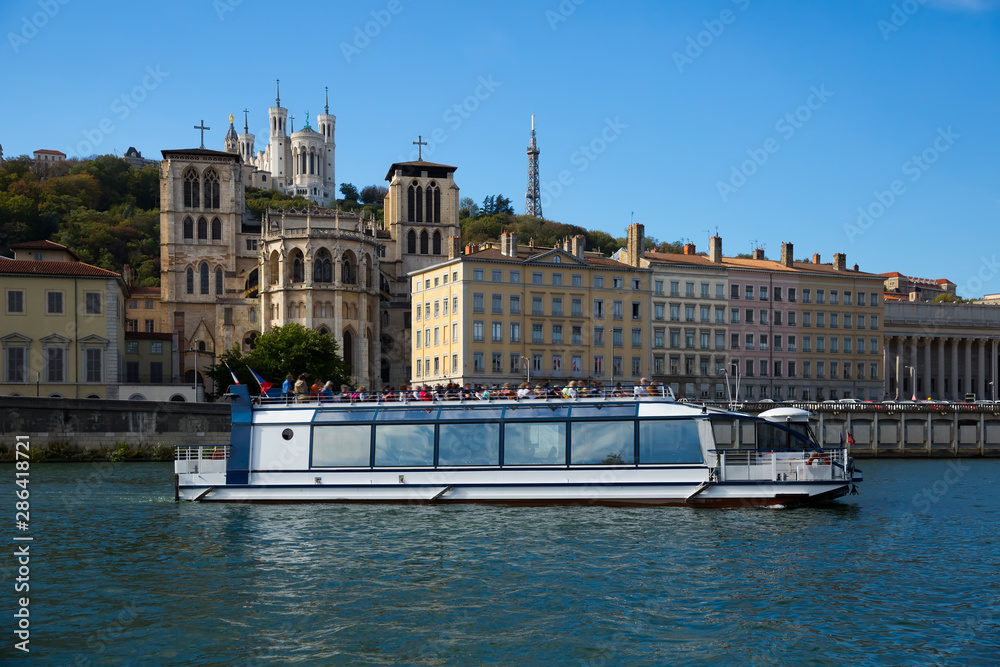 Pleasure ship sailing on Saone river, Lyon