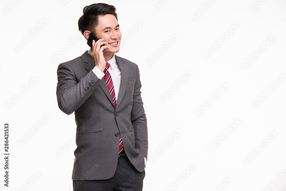 Businessman using smartphone, excited by it.. Businessman using smartphone, excited by it..