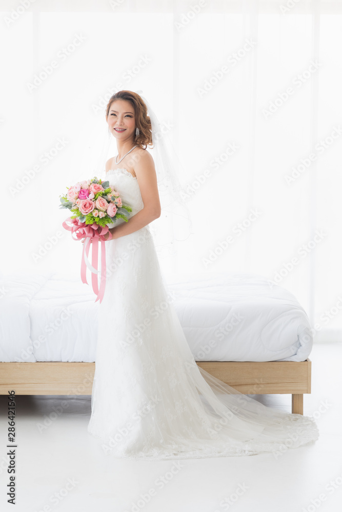 Bride is stands in beautiful white wedding dress.. Bride is stands in beautiful white wedding dress..