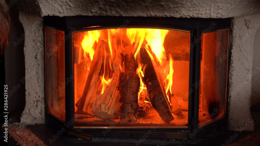 Wood fire burning in bar lounge. Shot in both Slow Motion and real time with the Sony a7iii and Ronin S.