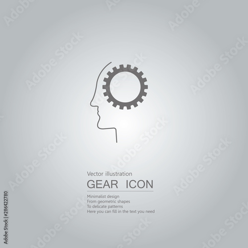 Gears and face. The background is a gray gradient.