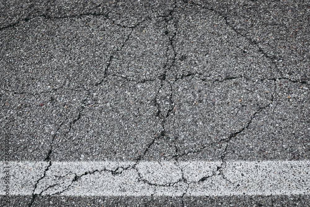 white painted road markings on a pavement for a background white painted road markings on a pavement for a background