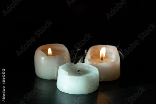 mourning candles on black background