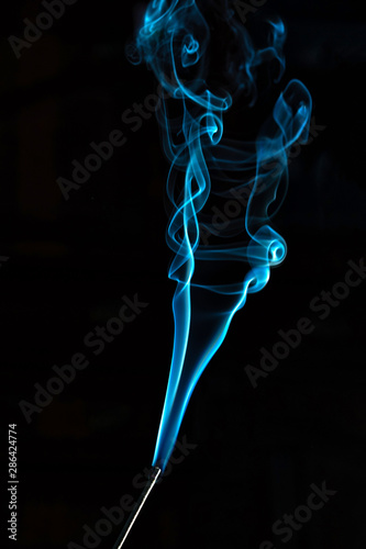 smoke aroma sticks on black background