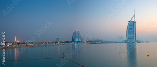 Fényképezés DUBAI, UAE - MARCH 30, 2017: The evening skyline with the Burj al Arab and Jumeirah Beach Hotel