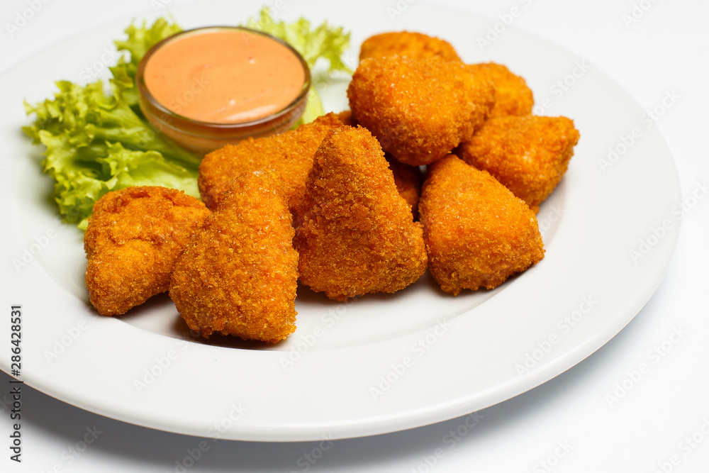 deep fried cheese slices with a sauce