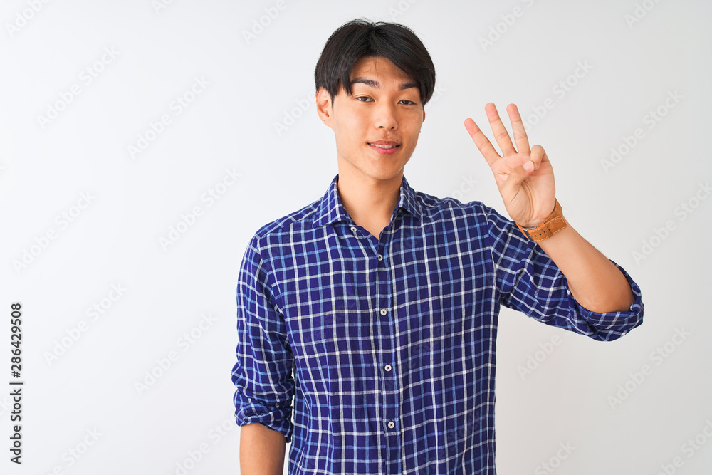 Young chinese man wearing casual blue shirt standing over isolated white background showing and pointing up with fingers number three while smiling confident and happy. Young chinese man wearing casual blue shirt standing over isolated white background showing and pointing up with fingers number three while smiling confident and happy.