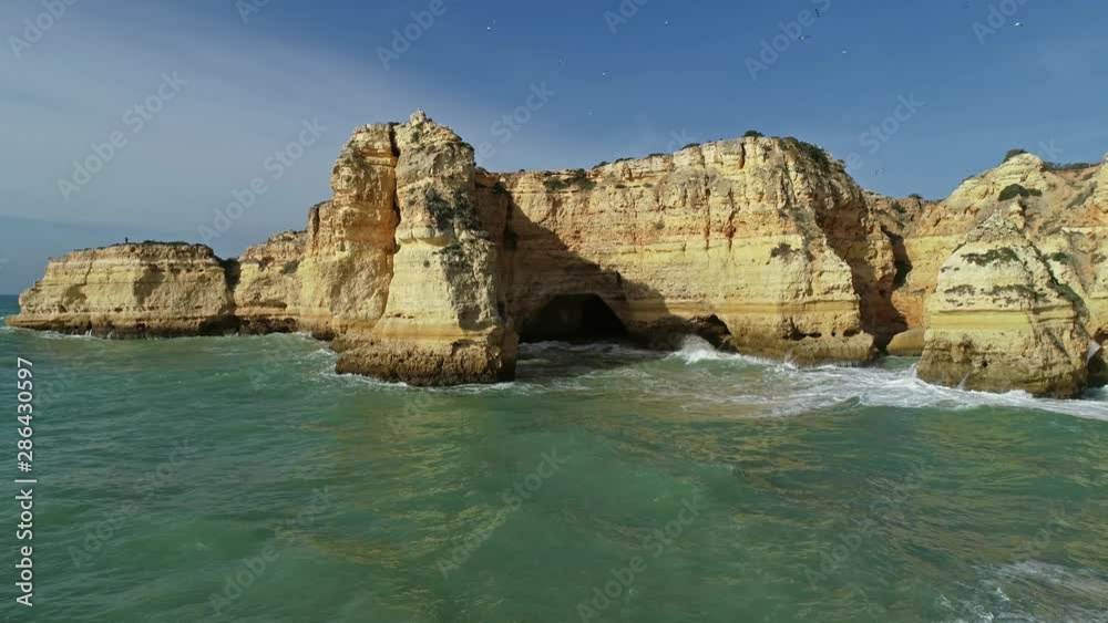Aerial panorama view on rock cliffs and waves near Praia da Marinha in the Algarve, Portugal, 4k Aerial panorama view on rock cliffs and waves near Praia da Marinha in the Algarve, Portugal, 4k