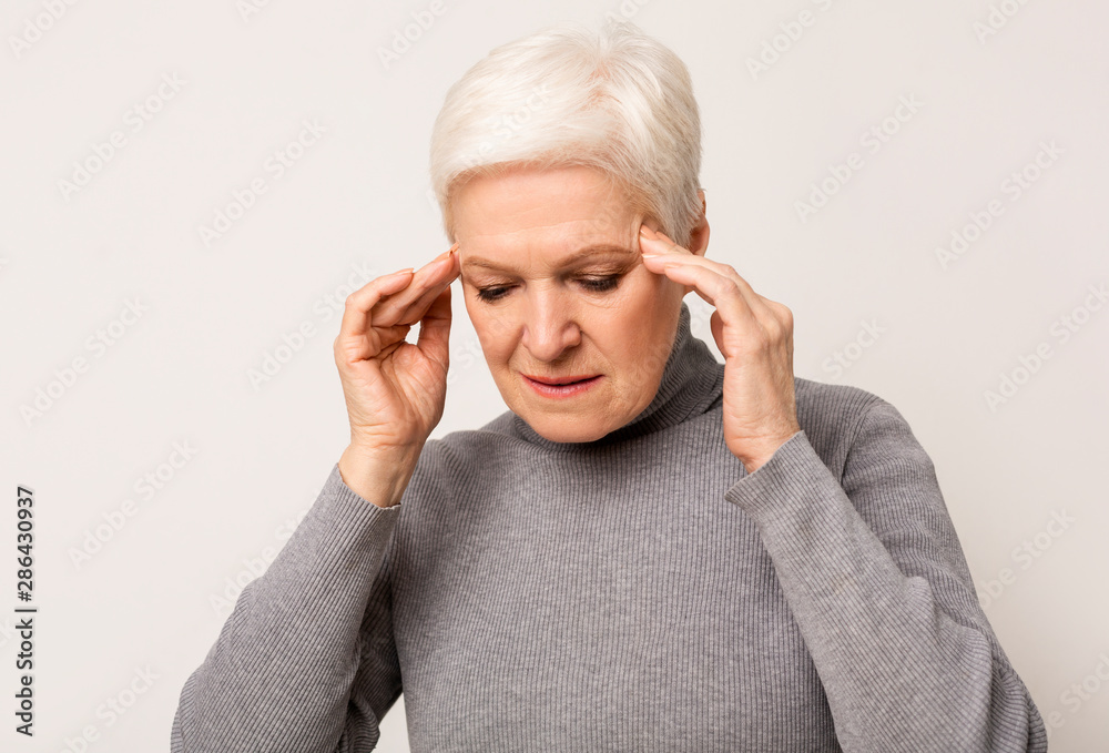 Depressed Senior Woman Touching Temples, Having Headache Depressed Senior Woman Touching Temples, Having Headache