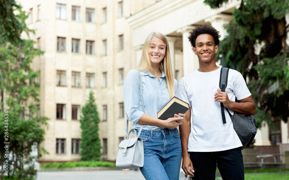 College students. Teens posing to camera in campus College students. Teens posing to camera in campus