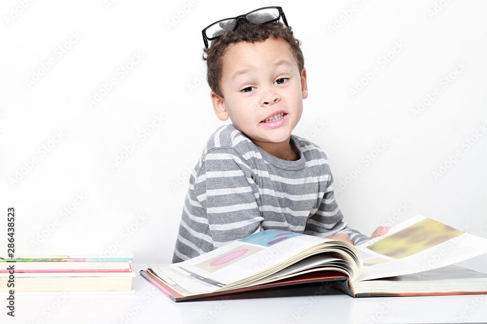 child reading book at school been educated on white background stock images stock photo child reading book at school been educated on white background stock images stock photo