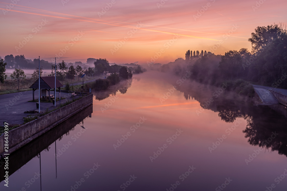 Just before sunrise at the bridge over the river Lys in Lauwe & Wevelgem, Belgium.