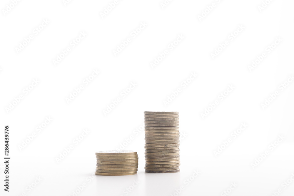 Stack of indian currency in coins arranged as a graph on white background Stack of indian currency in coins arranged as a graph on white background